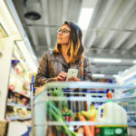 young mom using tips to help her with saving money on groceries