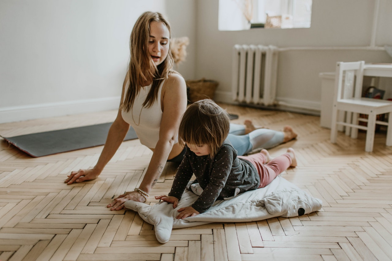 Mom and son stretching.