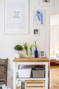 A table display in a home, filled with small items that add character.